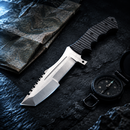 Carbon steel tracker survival knife dark luxury cinematic editorial shot with topographic map and black compass