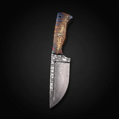 Handmade Damascus tracker hunting knife on a deep black charcoal studio background