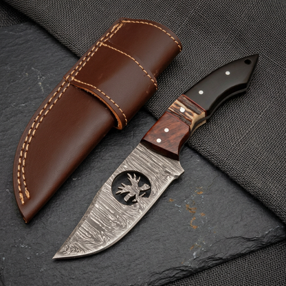 Editorial skinner knife composition showing deer motif and brown sheath