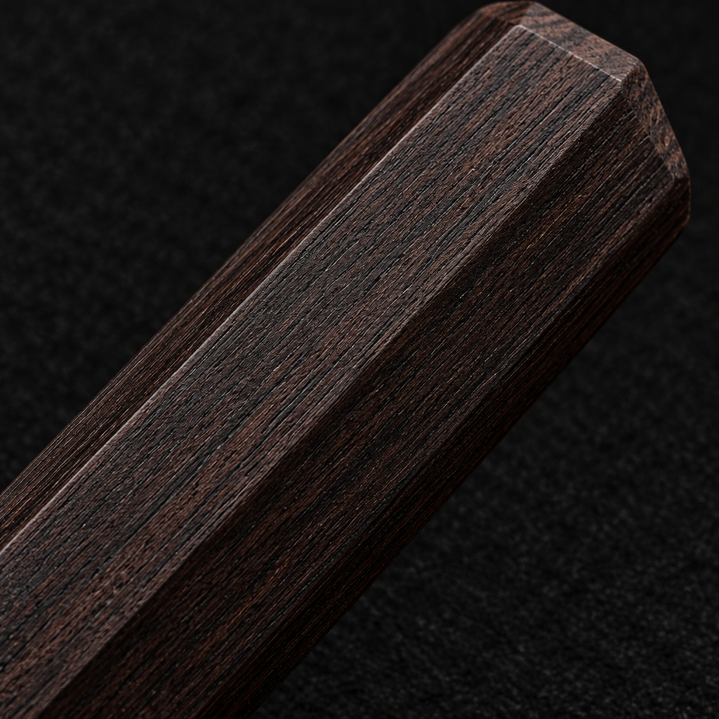 Extreme close-up of dark wenge wood octagonal knife handle with clean facets on deep black charcoal background