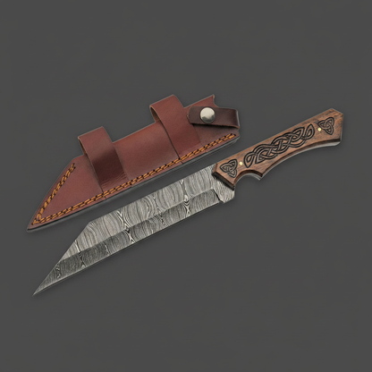 Custom handmade Damascus steel Seax knife with carved walnut handle and brown leather sheath on charcoal background, right-facing
