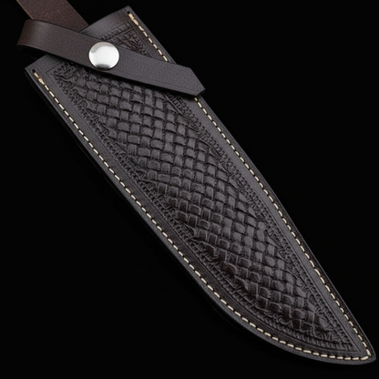 Extreme close-up of dark brown basketweave embossed genuine leather Bowie knife sheath diagonal angle silver snap on black background