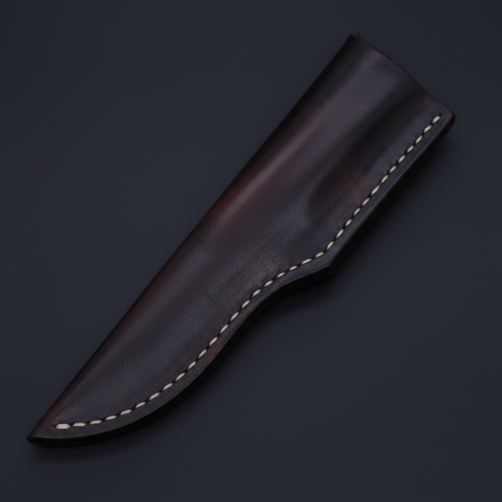 Handstitched dark brown genuine leather knife sheath diagonal angle on deep black charcoal background