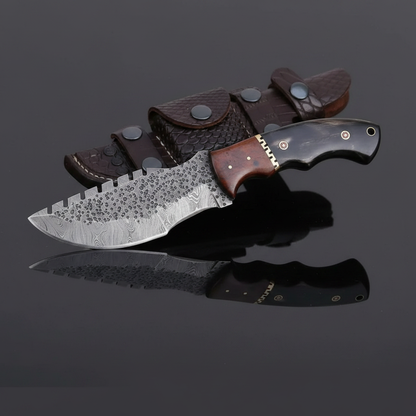 Damascus tracker knife in an opposite-direction studio mirror composition