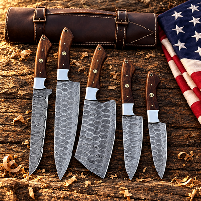 Handforged 5-piece Damascus steel chef knife set walnut handles hero flat lay on rustic dark wood with American USA flag