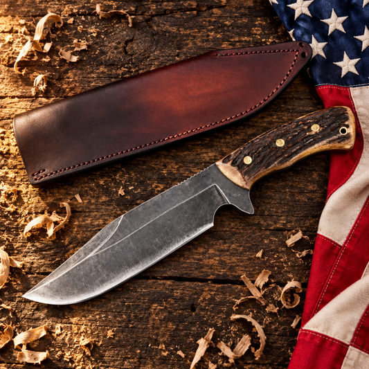 Carbon steel boar Bowie hunting knife stag antler handle hero flat lay on rustic dark wood with American USA flag