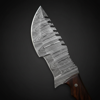 Close-up of the patterned Damascus steel blade on a plain near-black charcoal background