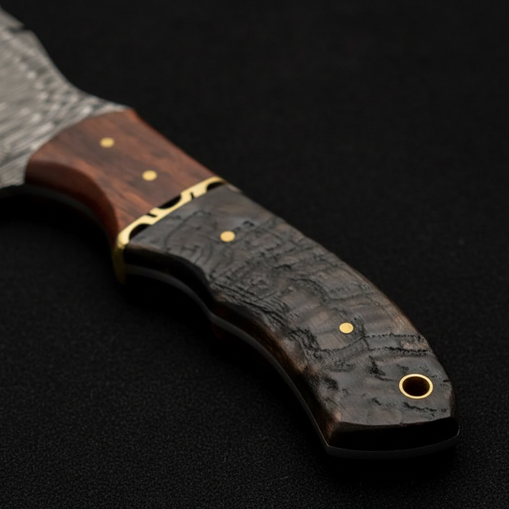 Close-up of two-tone natural ram horn and walnut wood handle with brass work and pins on charcoal background