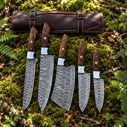 Handforged 5-piece Damascus steel chef knife set walnut handles and leather roll bag on thick green forest moss natural outdoor